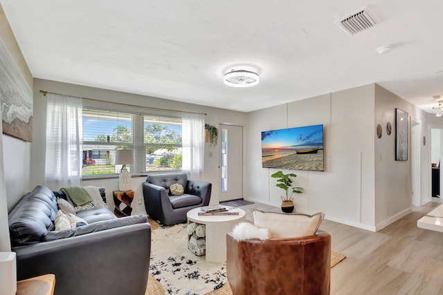 115 W 31st Ct, Riviera Beach, FL 33404 - living area with baseboards and light wood-style floors