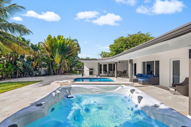 2500 NE 23rd St, Pompano Beach, FL 33062 - outdoor pool with an outdoor hot tub, an outdoor hangout area, ceiling fan, and a patio area