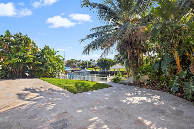2500 NE 23rd St, Pompano Beach, FL 33062 - view of patio featuring fence and a water view