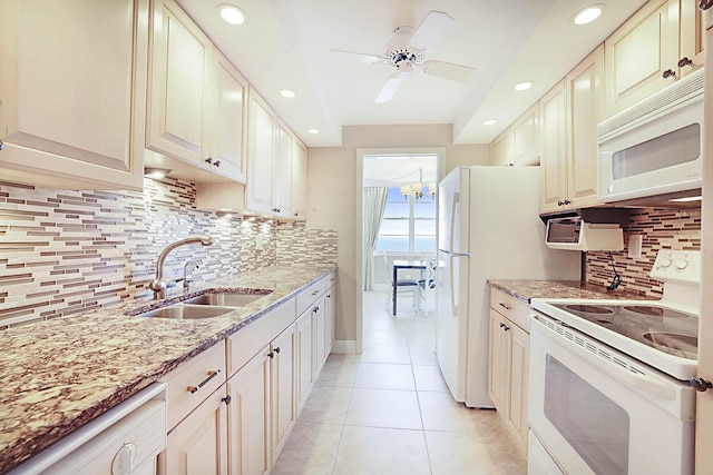 2121 N Ocean Blvd Unit 1707E, Boca Raton, FL 33431 - kitchen with white appliances, a sink, light tile patterned floors, decorative backsplash, and light stone countertops