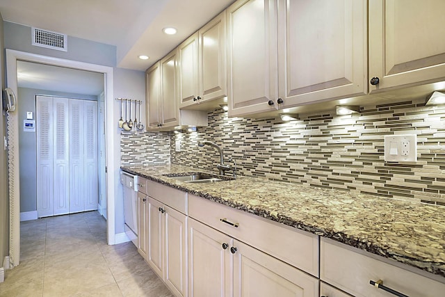2121 N Ocean Blvd Unit 1707E, Boca Raton, FL 33431 - kitchen featuring a sink, decorative backsplash, light stone countertops, light tile patterned floors, and recessed lighting