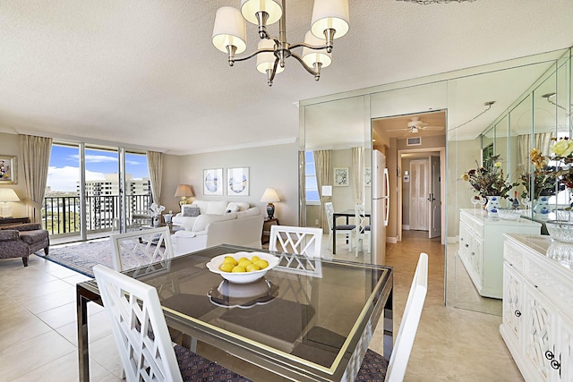 2121 N Ocean Blvd Unit 1707E, Boca Raton, FL 33431 - dining area with crown molding, a chandelier, a textured ceiling, light tile patterned flooring, and a ceiling fan