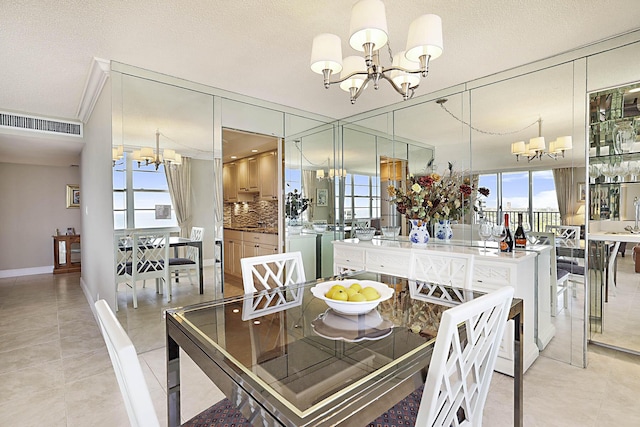 2121 N Ocean Blvd Unit 1707E, Boca Raton, FL 33431 - dining space with a chandelier, baseboards, and light tile patterned floors