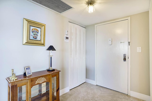 2121 N Ocean Blvd Unit 1707E, Boca Raton, FL 33431 - foyer with baseboards and light tile patterned floors
