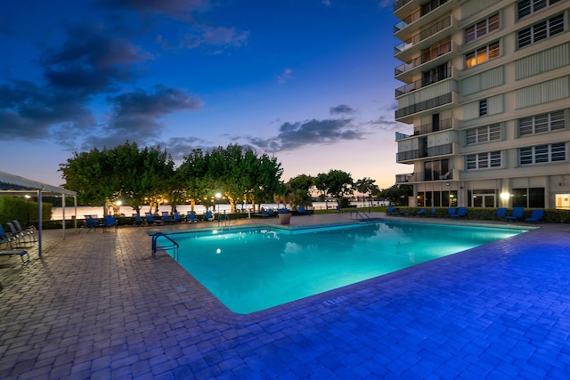 2121 N Ocean Blvd Unit 1707E, Boca Raton, FL 33431 - pool at dusk with a community pool and a patio area