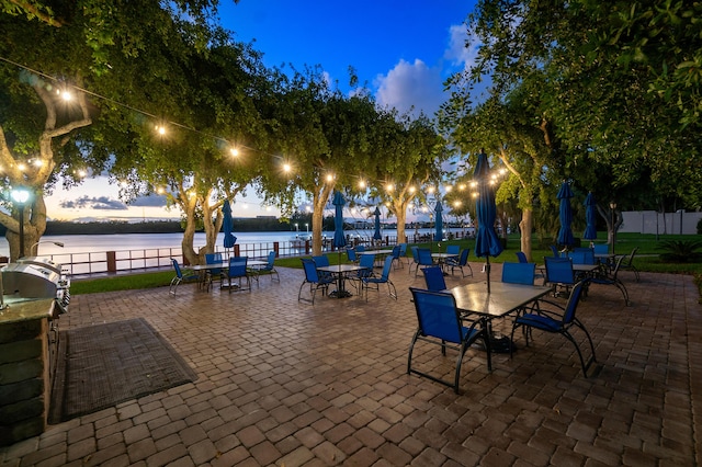2121 N Ocean Blvd Unit 1707E, Boca Raton, FL 33431 - view of patio with fence, outdoor dining area, and a water view