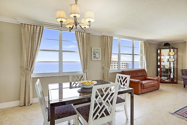 2121 N Ocean Blvd Unit 1707E, Boca Raton, FL 33431 - dining area with a chandelier, a water view, ornamental molding, a textured ceiling, and light tile patterned floors