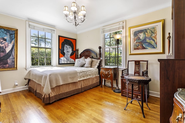 335 Monroe Dr, West Palm Beach, FL 33405 - bedroom featuring a chandelier, light wood-type flooring, ornamental molding, and baseboards