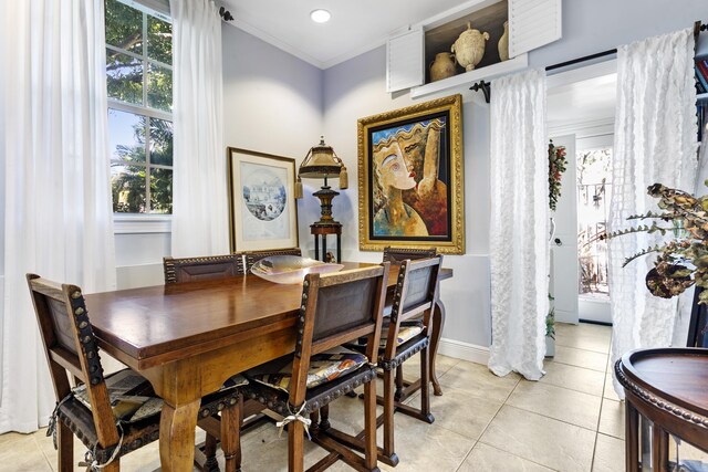 335 Monroe Dr, West Palm Beach, FL 33405 - dining area with light tile patterned floors, ornamental molding, baseboards, and recessed lighting