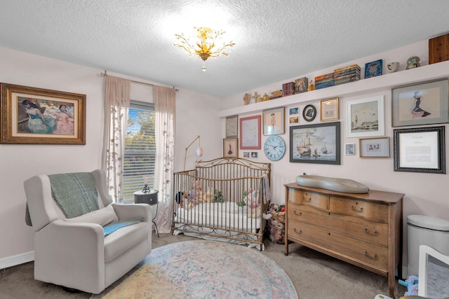 18143 42nd Rd, The Acreage, FL 33470 - bedroom featuring carpet, a textured ceiling, a chandelier, and a nursery area