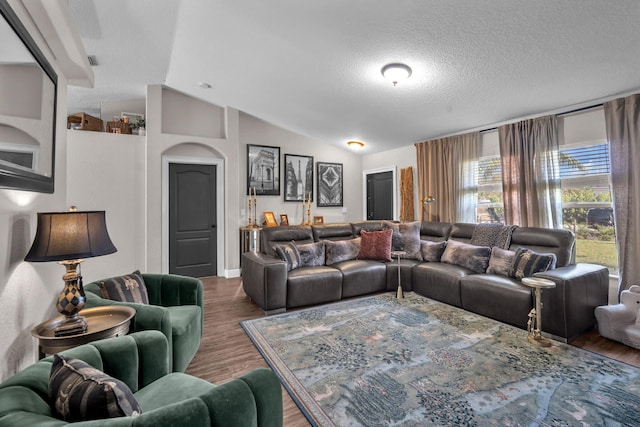 18143 42nd Rd, The Acreage, FL 33470 - living area with vaulted ceiling, wood finished floors, and a textured ceiling