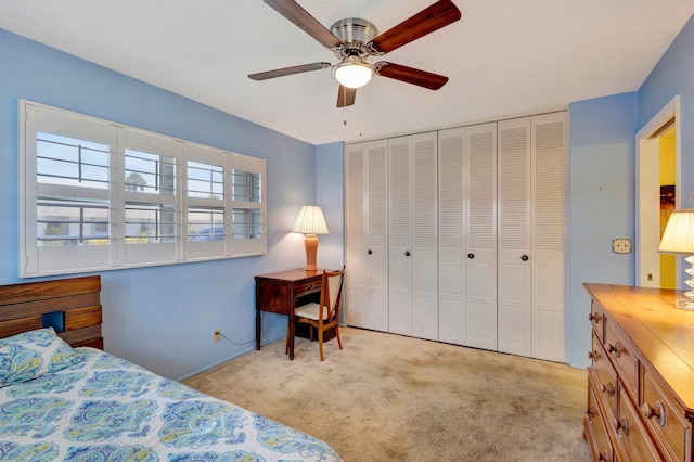 bedroom featuring carpet flooring, a closet, and ceiling fan
