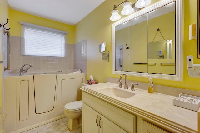 bathroom with tile patterned flooring, vanity, a bath, and toilet