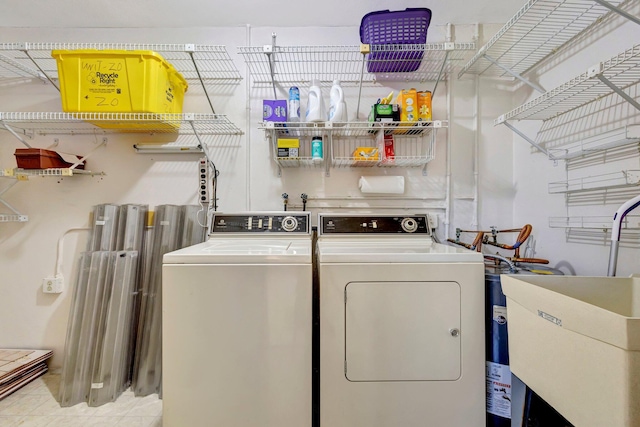 laundry area with separate washer and dryer