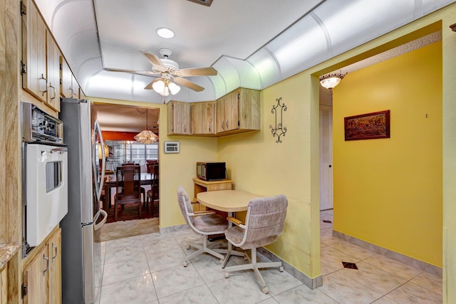 dining space featuring ceiling fan