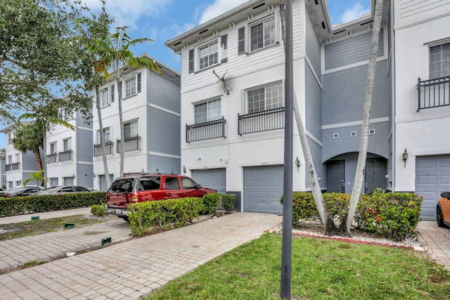 3599 NW 14th Ct, Lauderhill, FL 33311 - view of building exterior with a garage and driveway