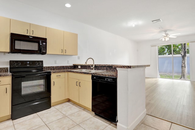 3599 NW 14th Ct, Lauderhill, FL 33311 - kitchen featuring black appliances, a sink, a peninsula, a ceiling fan, and light tile patterned flooring