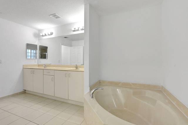 3599 NW 14th Ct, Lauderhill, FL 33311 - bathroom with double vanity, a garden tub, and tile patterned flooring
