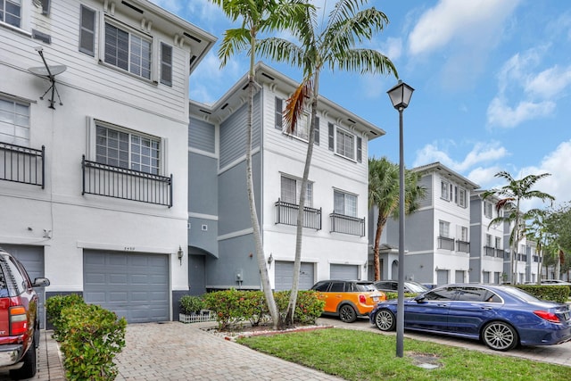 3599 NW 14th Ct, Lauderhill, FL 33311 - view of property with an attached garage and driveway