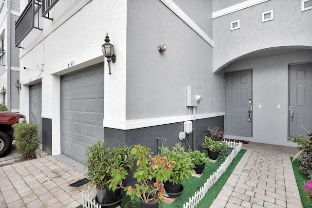 3599 NW 14th Ct, Lauderhill, FL 33311 - property entrance featuring stucco siding and an attached garage