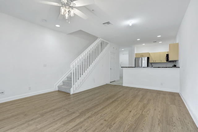 3599 NW 14th Ct, Lauderhill, FL 33311 - unfurnished living room featuring recessed lighting, stairway, light wood-style flooring, ceiling fan, and baseboards