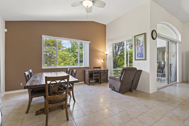 1235 SW Briarwood Dr, Port Saint Lucie, FL 34986 - dining area featuring light tile patterned floors, a ceiling fan, high vaulted ceiling, and baseboards