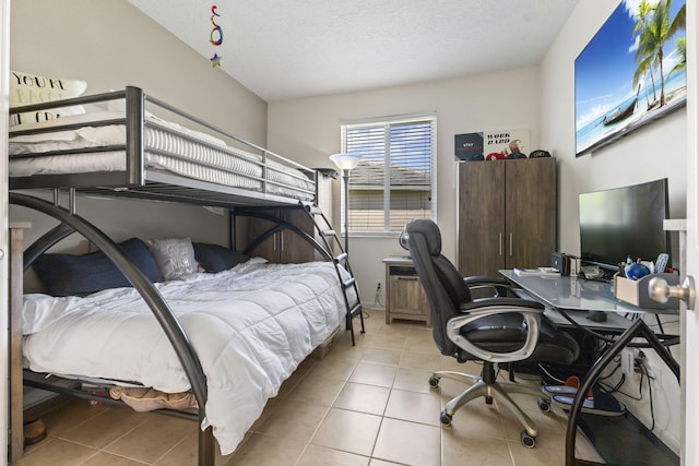 1235 SW Briarwood Dr, Port Saint Lucie, FL 34986 - tiled bedroom featuring an office area and a textured ceiling