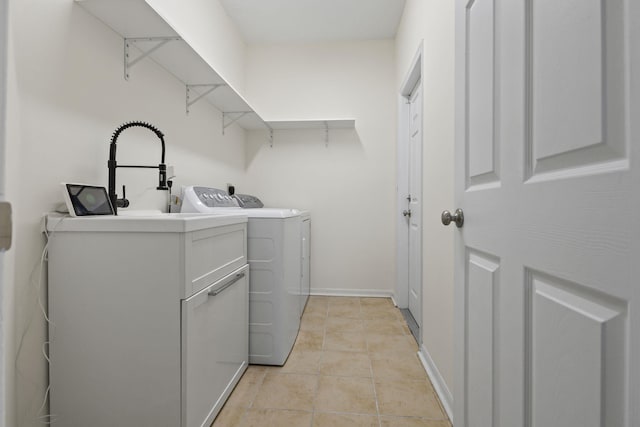 1235 SW Briarwood Dr, Port Saint Lucie, FL 34986 - clothes washing area featuring separate washer and dryer, cabinet space, light tile patterned floors, and baseboards