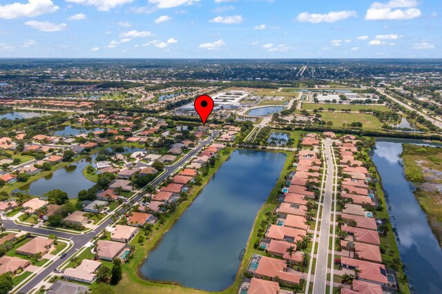 1235 SW Briarwood Dr, Port Saint Lucie, FL 34986 - aerial overview of property's location featuring nearby suburban area and a nearby body of water