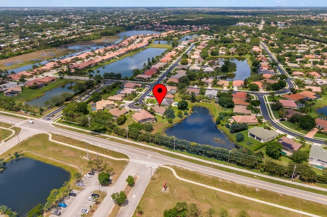 1235 SW Briarwood Dr, Port Saint Lucie, FL 34986 - aerial view of property's location featuring a nearby body of water and nearby suburban area