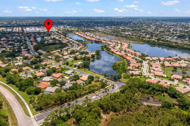 1235 SW Briarwood Dr, Port Saint Lucie, FL 34986 - aerial overview of property's location with a nearby body of water and nearby suburban area