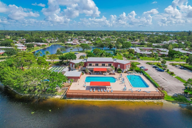 birds eye view of property featuring a water view