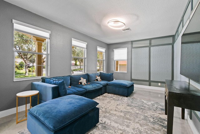 111 Tullamore Ave, Jupiter, FL 33458 - living area with baseboards, a textured ceiling, and a textured wall
