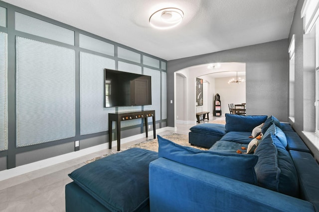 111 Tullamore Ave, Jupiter, FL 33458 - living room with arched walkways and a chandelier