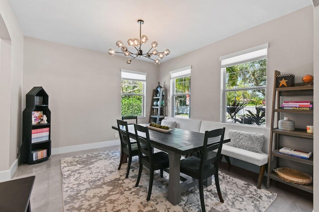 111 Tullamore Ave, Jupiter, FL 33458 - dining space with a chandelier and baseboards