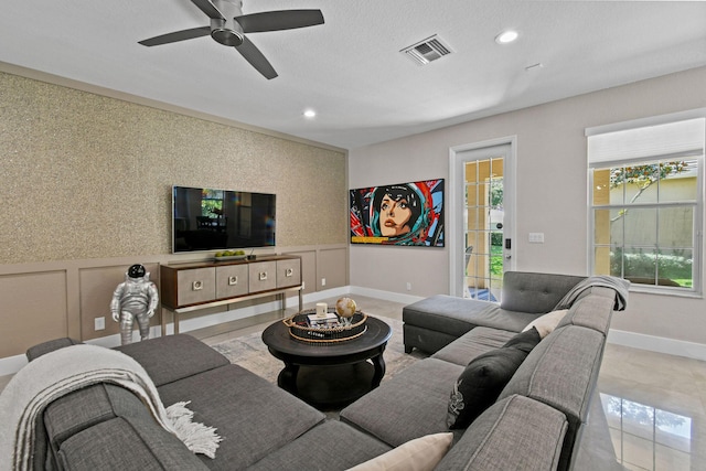 111 Tullamore Ave, Jupiter, FL 33458 - living room with healthy amount of natural light, ceiling fan, recessed lighting, a wainscoted wall, and wallpapered walls