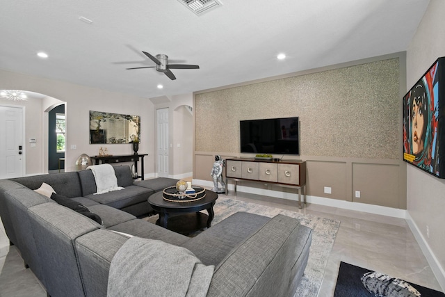 111 Tullamore Ave, Jupiter, FL 33458 - living area with arched walkways, ceiling fan, recessed lighting, and baseboards