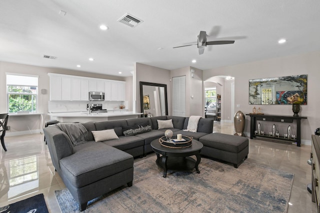 111 Tullamore Ave, Jupiter, FL 33458 - living area with arched walkways, ceiling fan, baseboards, and recessed lighting