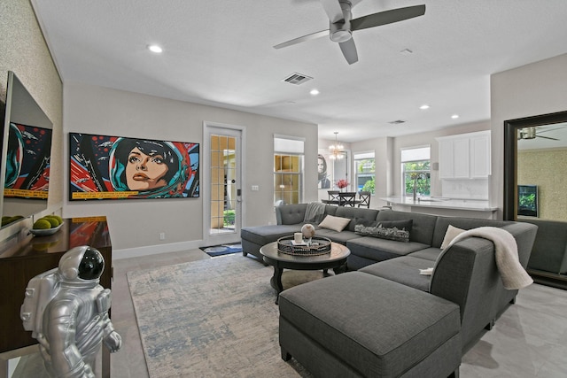 111 Tullamore Ave, Jupiter, FL 33458 - living area with a ceiling fan, recessed lighting, and a chandelier