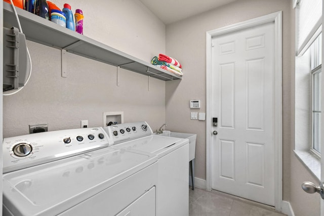 111 Tullamore Ave, Jupiter, FL 33458 - laundry area featuring washing machine and dryer, baseboards, and light tile patterned floors