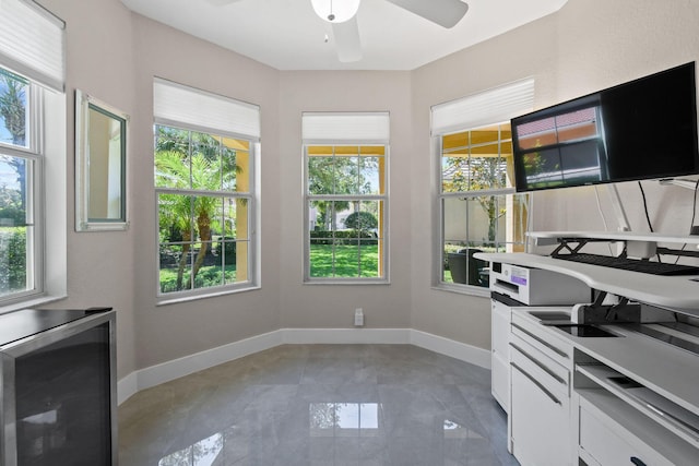 111 Tullamore Ave, Jupiter, FL 33458 - unfurnished dining area featuring wine cooler, plenty of natural light, a ceiling fan, and baseboards