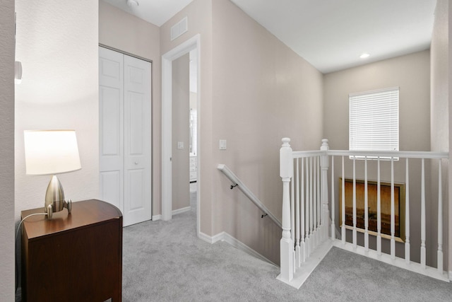 111 Tullamore Ave, Jupiter, FL 33458 - corridor with an upstairs landing, carpet, and baseboards