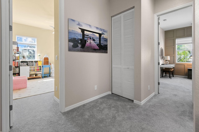 111 Tullamore Ave, Jupiter, FL 33458 - corridor featuring carpet and baseboards