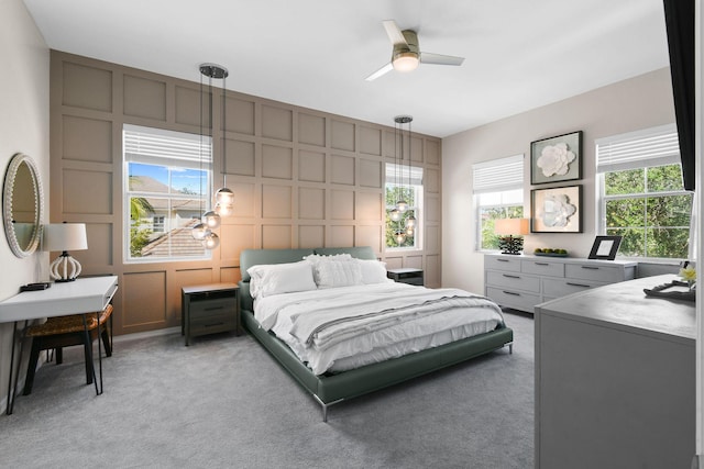 111 Tullamore Ave, Jupiter, FL 33458 - bedroom featuring a decorative wall, light colored carpet, and a ceiling fan