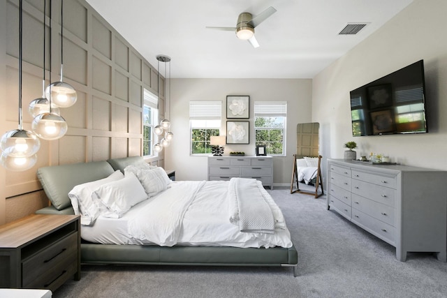 111 Tullamore Ave, Jupiter, FL 33458 - carpeted bedroom with multiple windows and a ceiling fan