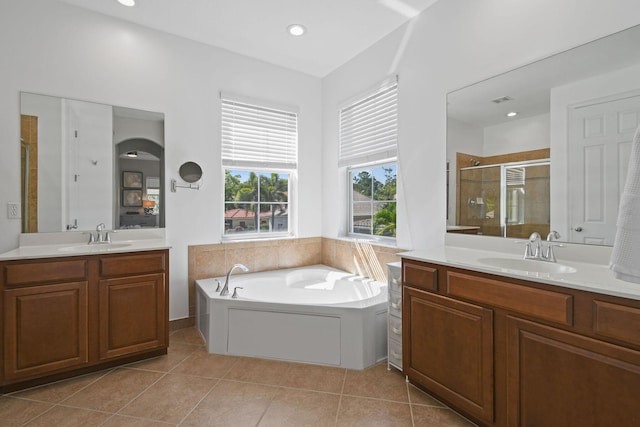 111 Tullamore Ave, Jupiter, FL 33458 - bathroom featuring two vanities, a shower stall, a garden tub, tile patterned floors, and recessed lighting