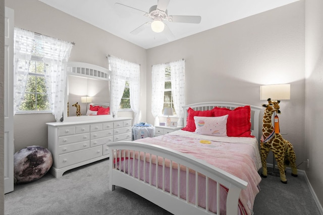 111 Tullamore Ave, Jupiter, FL 33458 - carpeted bedroom featuring multiple windows and a ceiling fan