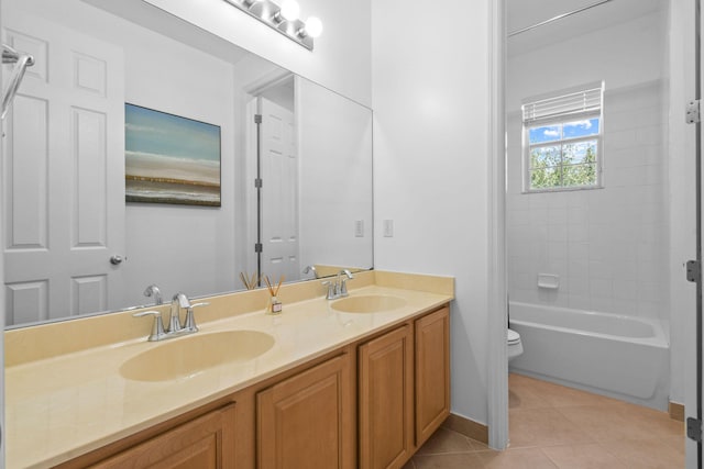 111 Tullamore Ave, Jupiter, FL 33458 - bathroom featuring toilet, double vanity, tile patterned floors, and baseboards
