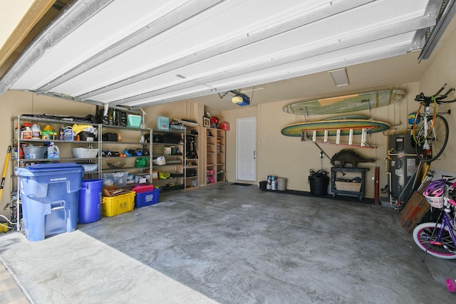 111 Tullamore Ave, Jupiter, FL 33458 - garage with a garage door opener and hybrid water heater