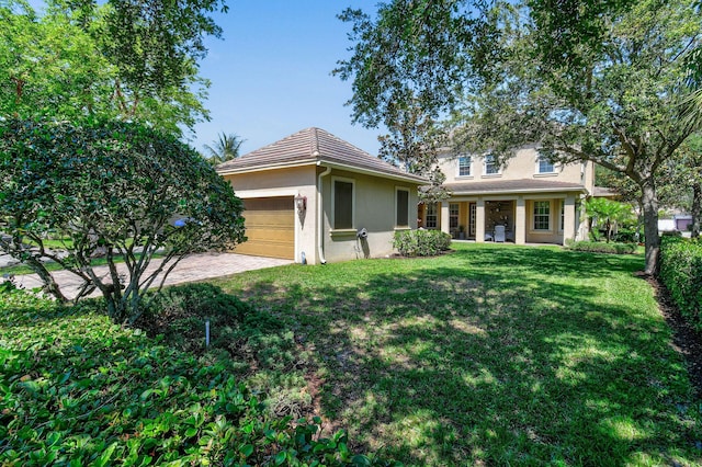 111 Tullamore Ave, Jupiter, FL 33458 - view of front of property with stucco siding and a front lawn